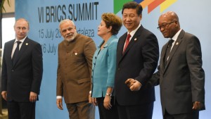 Russian President Vladimir Putin (L), Indian Prime Minister Narendra Modi (2nd-L), Brazilian President Dilma Rousseff (C), Chinese President Xi Jinping (2nd-R) and South African President Jacob Zuma pose for the photo session during the 6th BRICS Summit in Fortaleza, Brazil, on July 15, 2014. Leaders of the BRICS (Brazil, Russia, India, China and South Africa) group of emerging powers gathered in Brazil on Tuesday to launch a new development bank and a reserve fund seen as counterweights to Western-led financial institutions.  AFP PHOTO / YASUYOSHI CHIBA        (Photo credit should read YASUYOSHI CHIBA/AFP/Getty Images)