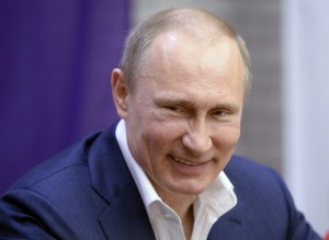 epa04115407 Russian President Vladimir Putin smiles while meeting with female Paralympic athletes and volunteers celebrating International Women's Day in the Paralympic Village in Krasnaya Polyana, Russia, 08 March 2014.  EPA/ALEXEY NIKOLSKY /RIA NOVOSTI / KREMLIN POOL Mandatory credit  Dostawca: PAP/EPA.