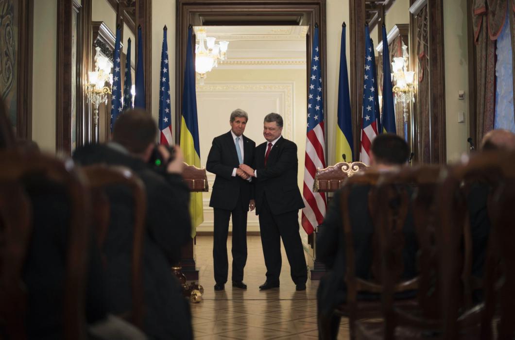 Ukraine's President Poreshenko shakes hands with U.S. Secretary of State Kerry after delivering a statement following a bilateral meeting in Kiev