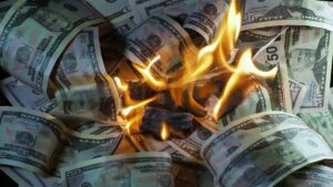 bigstock-A-Lot-Of-Dollars-In-The-Fire-371166664-1